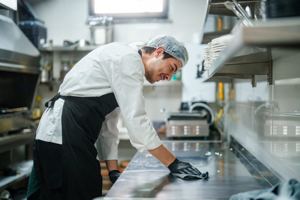 Part of a series of chef working in a restaurant's kitchen.